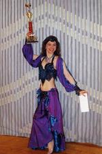 Piper poses with 1st place trophy from the Belly Dancer of the Year Competition in 2000