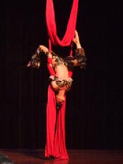 Melina performs a daring combination of Silks, Lyra, and belly dance on air 171