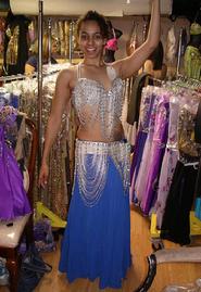 Bastet of the Baltimore Daughters of Rhea Dance Ensemble tries on a two piece silver and blue costume