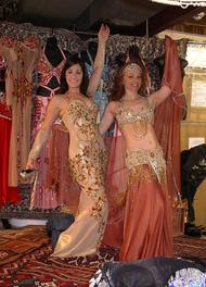 Amelia and Piper pose in costumes at Shahrzad's Belly Dance Store in Saverna Park, MD