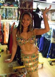 Rowina of the Baltimore Daughters of Rhea Belly Dance Ensemble vogues in Pharaonic splendor