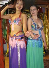 Kaoru and Rachel of the Daughters of Rhea Belly Dance Troupe in Baltimore choose costumes for Belly Dance Magic