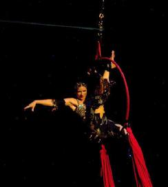 Melina performs a daring combination of Silks, Lyra, and belly dance on air 1204