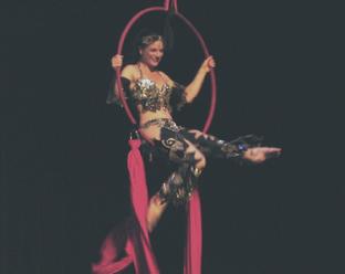 Melina performs a daring combination of Silks, Lyra, and belly dance 3