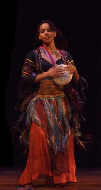 Bastet plays tabla while dancing in Rhea's Sibek choreography at Belly Dance Magic 2007